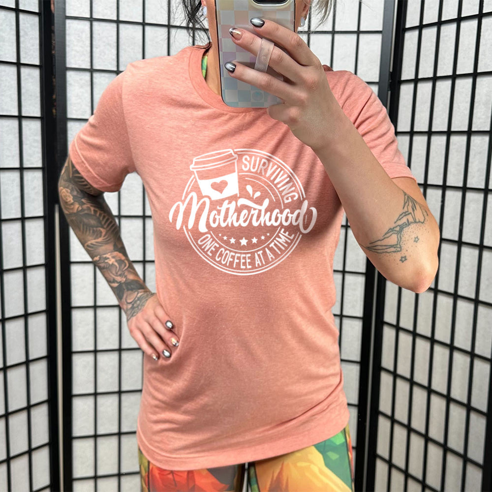 Surviving Motherhood One Coffee at a Time Shirt Unisex